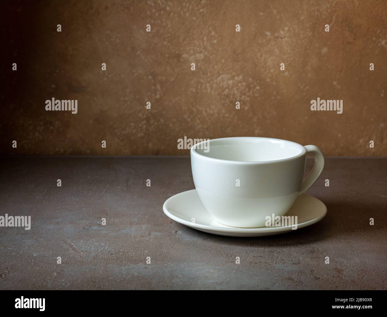 white empty coffee cup on restaurant table Stock Photo