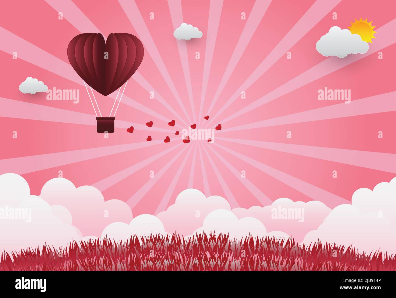 Valentine's day balloons in a heart shaped flying over grass view ...
