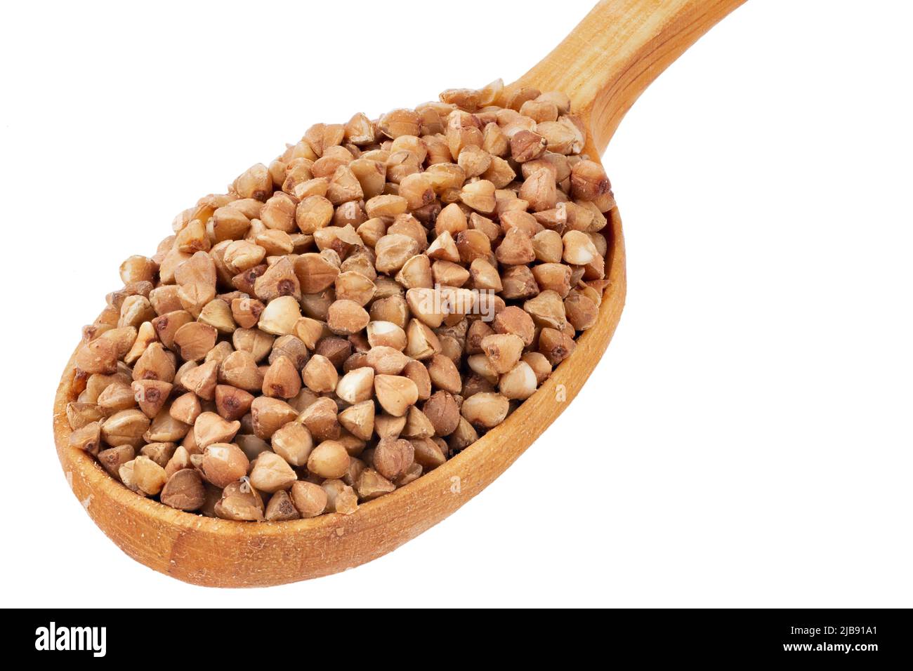 Buckwheat in a wooden spoon isolated on white. Top view. File contains