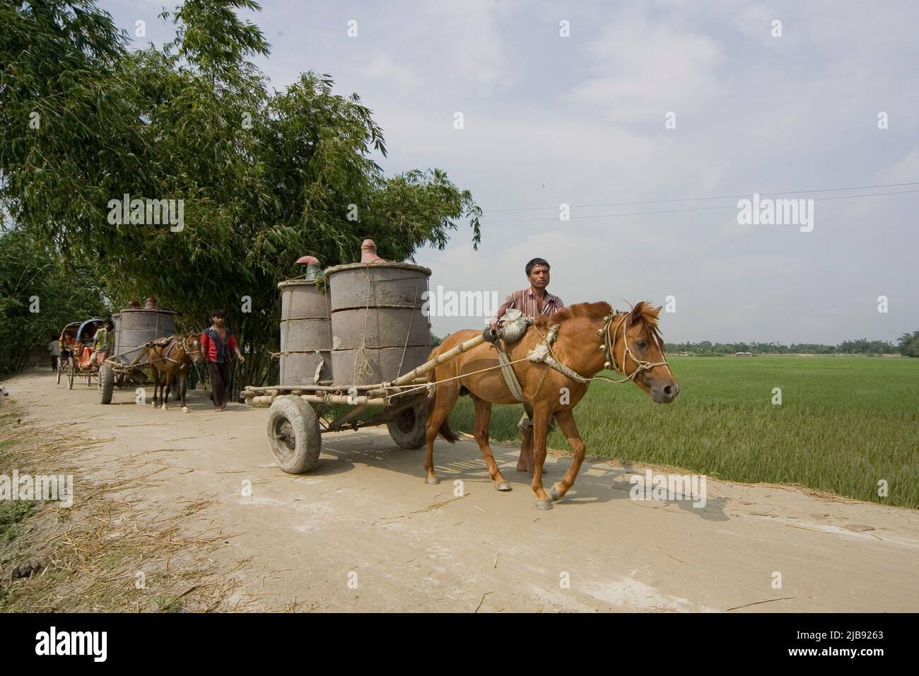 A cart carrying oil. Bangladesh Stock Photo Alamy