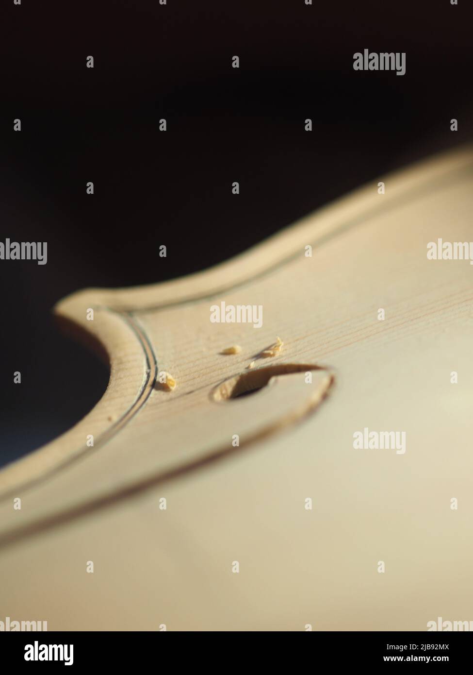 violinmaker cutting and sawing golden period cremonese violin model