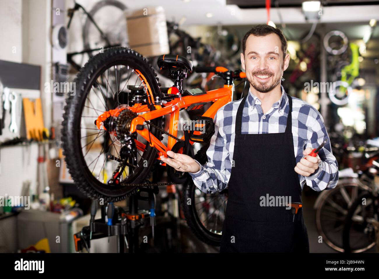 Man working on master mechanic assembling bicycle equipment Stock Photo Alamy