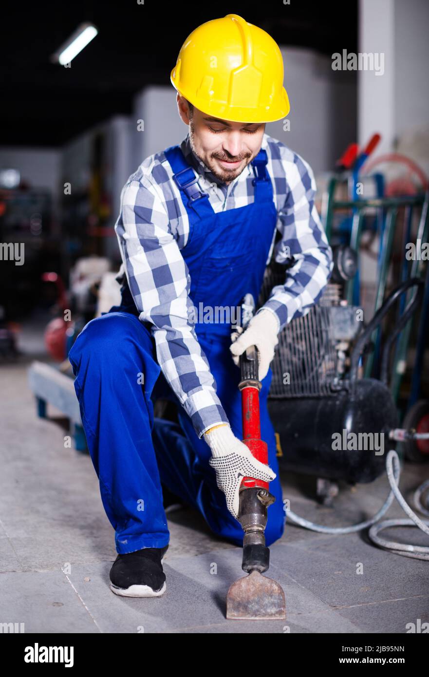 Worker work with demolition hammer Stock Photo Alamy