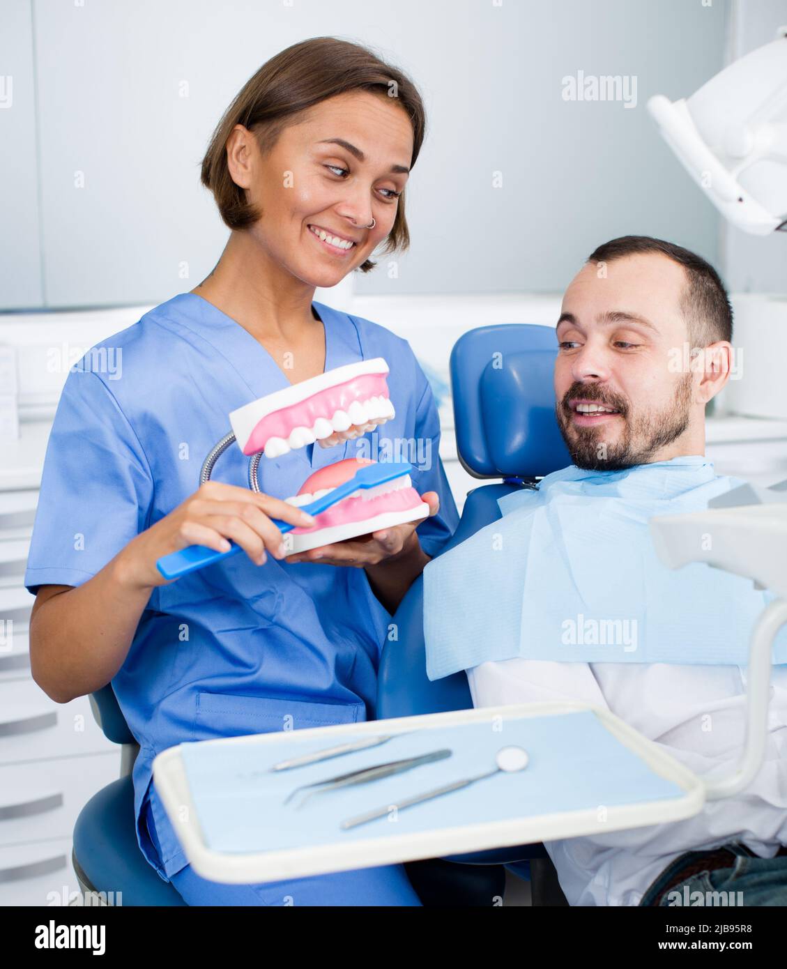 Orthodontist is telling about hygiene Stock Photo Alamy
