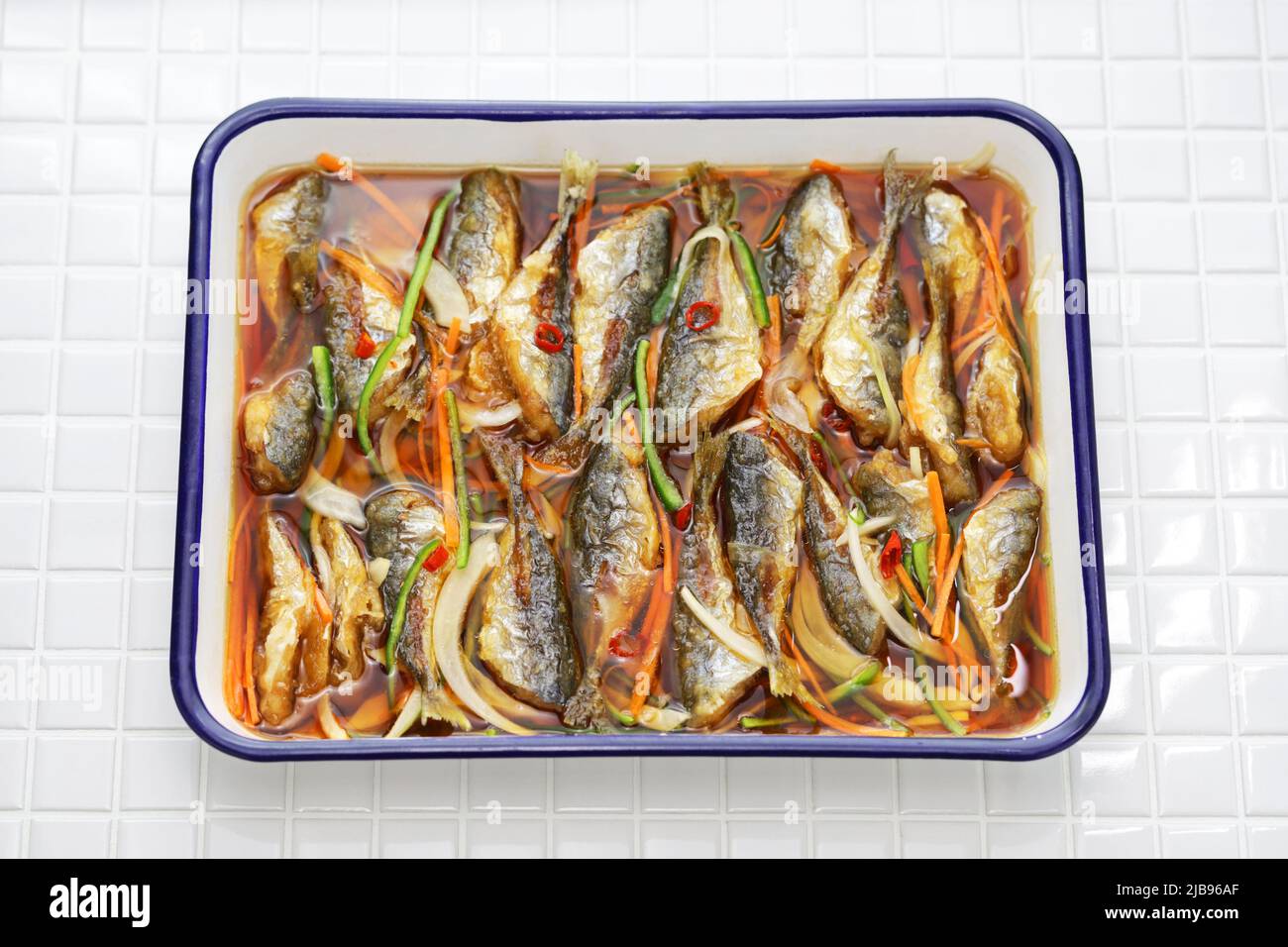 small fish escabeche ( deep fried horse mackerel marinated in spicy
