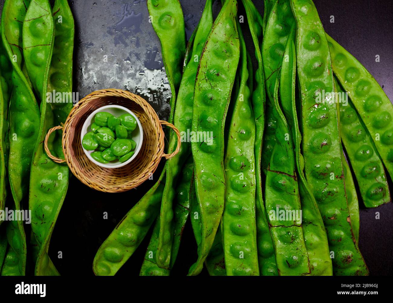 Fresh parkia speciosa with seed in wicker basket Stock Photo