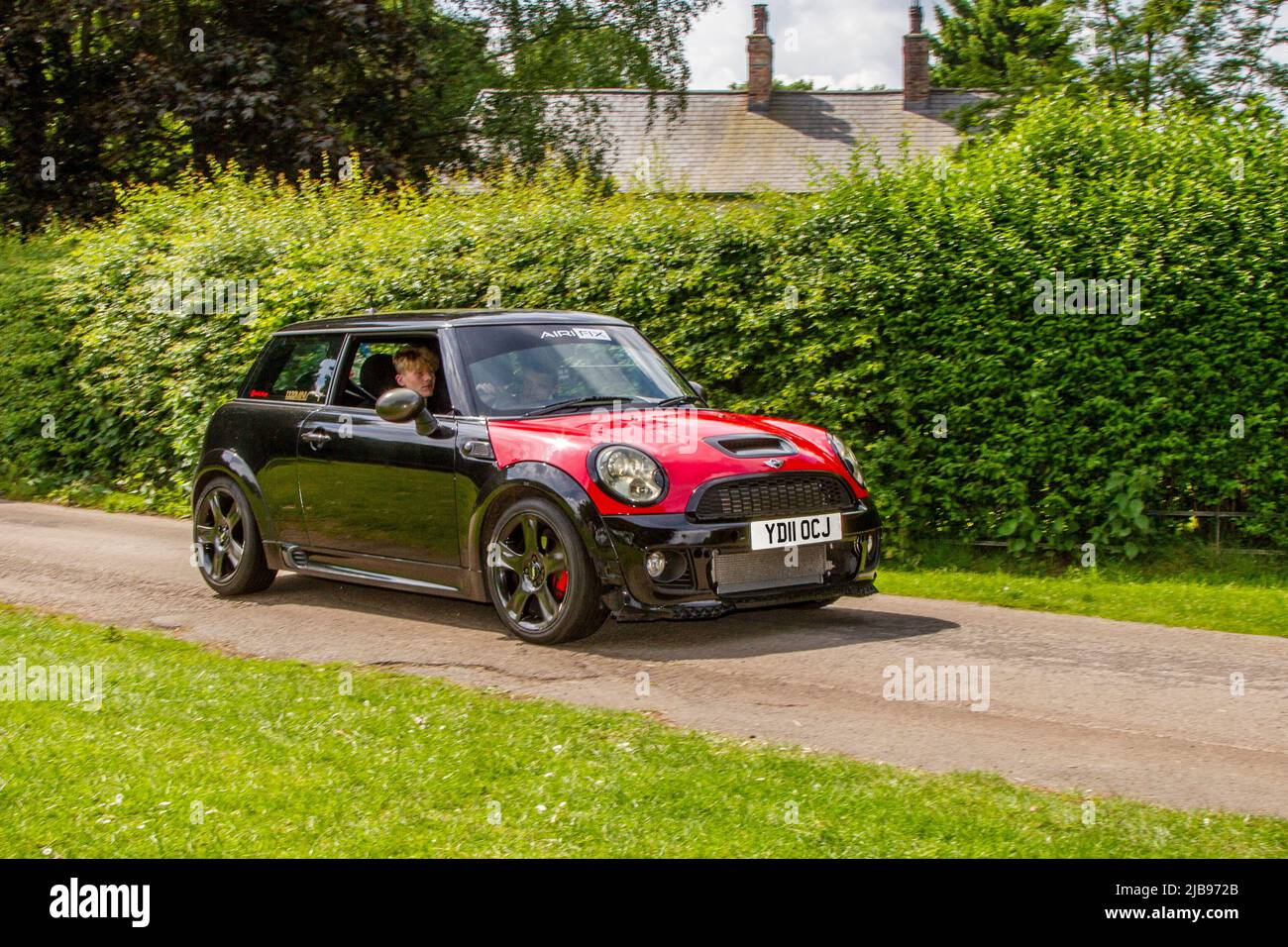 2011 black Mini One 1598cc petrol 6 speed manual arriving in Worden Park Motor Village for the Leyland Festival, UK Stock Photo