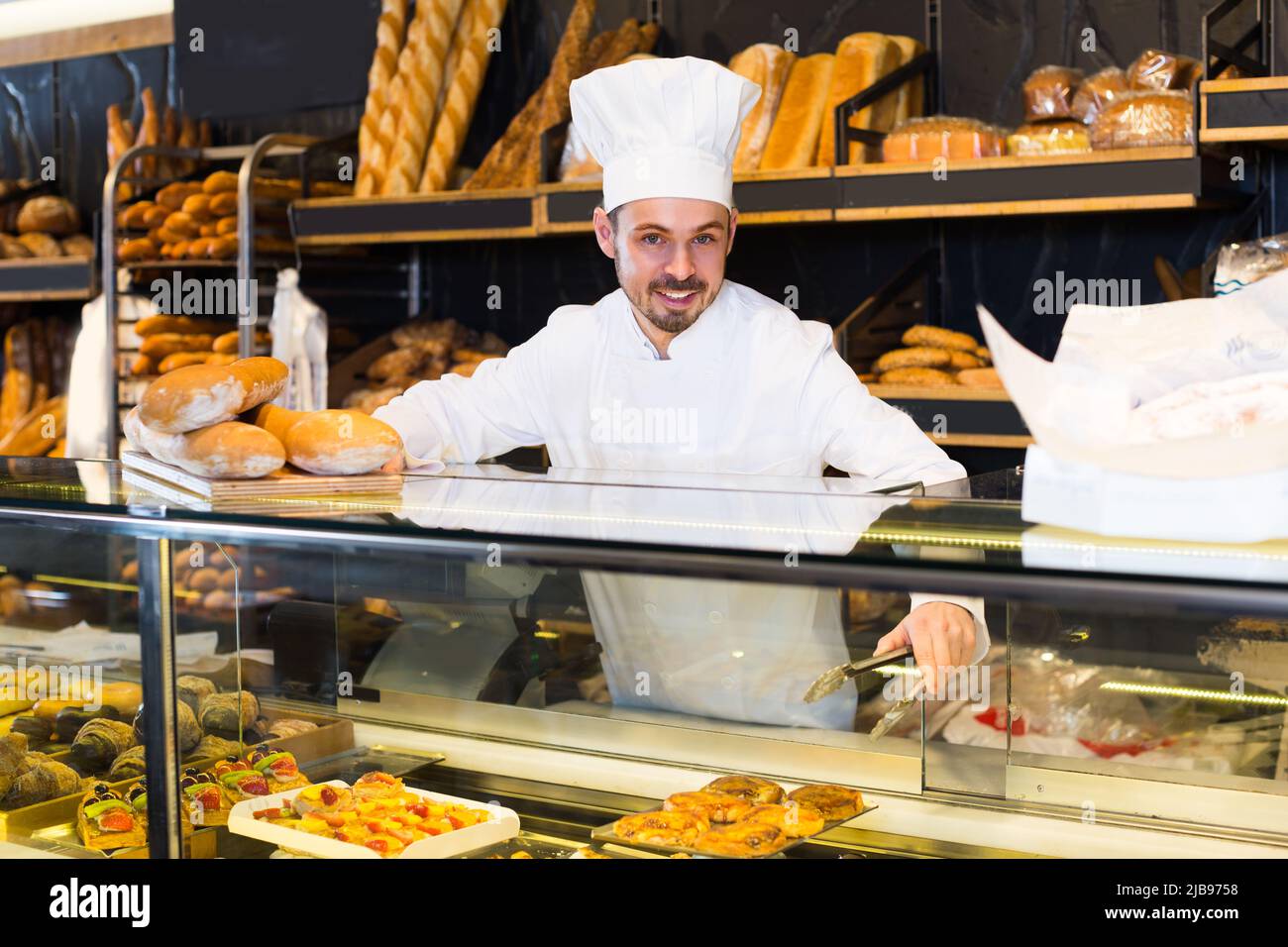 Young baker assistant hi-res stock photography and images - Alamy