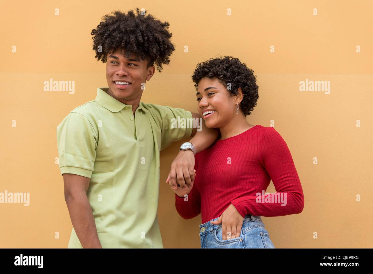 Portrait of smiling couple in front of wall, Panama city - stock photo Stock Photo