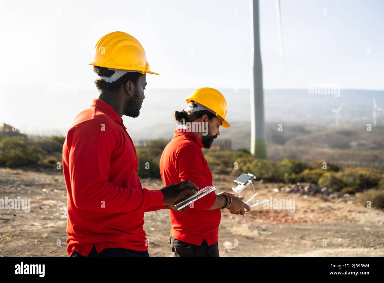 Drone engineers working on Eolic farm - Aerial engineering concept ...