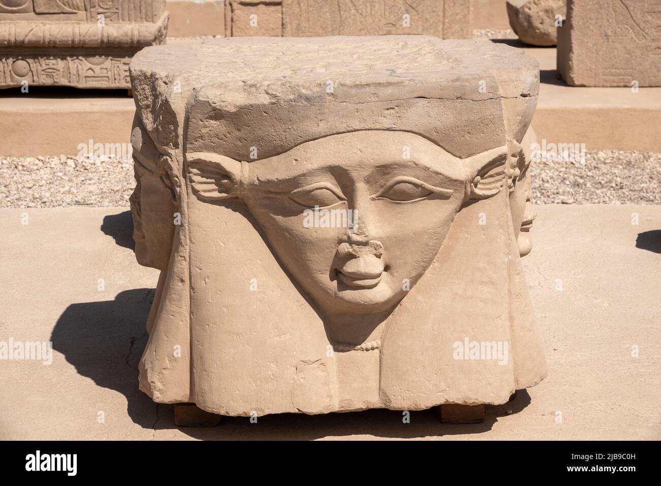Hathor head sculpture In the outer courtyard at Denderah Temple, near