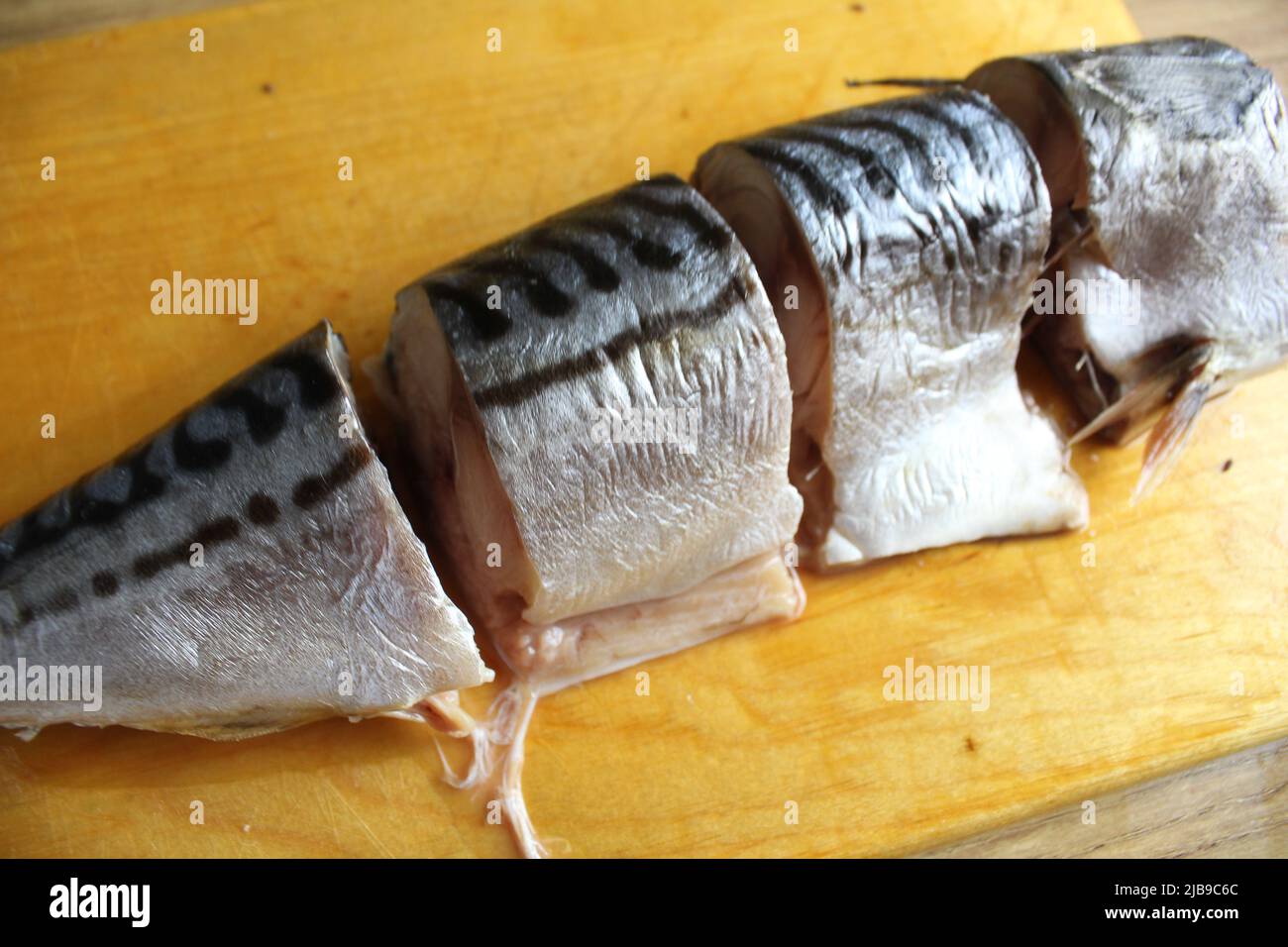 stepbystep cooking of fish. Cutting mackerel fish. Cut the fish