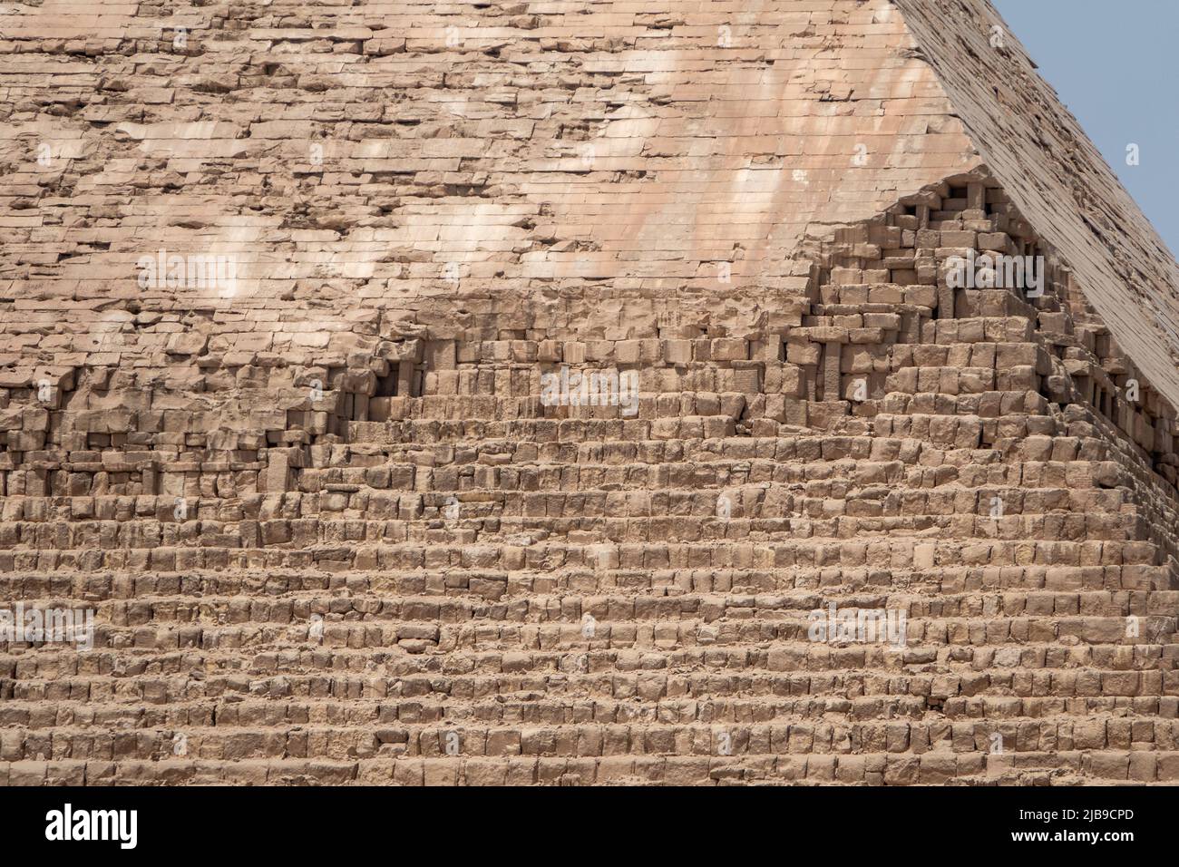Close up of Limestone casing on peak of Pyramid of Khafre on the Giza plateau, the Great Pyramids of Giza, Cairo, Egypt Stock Photo
