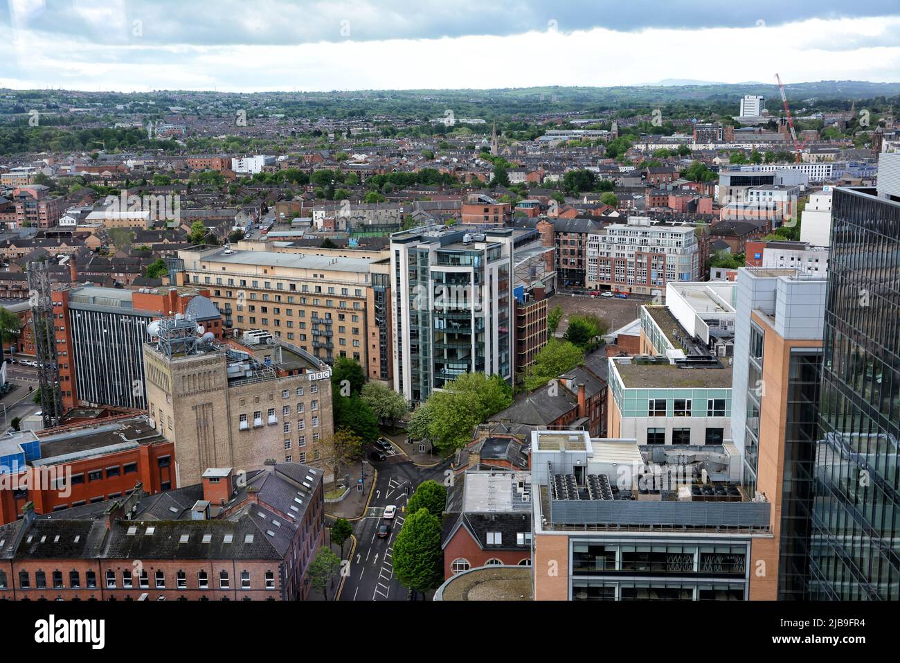 vBelfast, United Kingdom - 20 May 2022: Aerial view of the city with BBC palace in the foreground from a skyscraper, Belfast Stock Photo