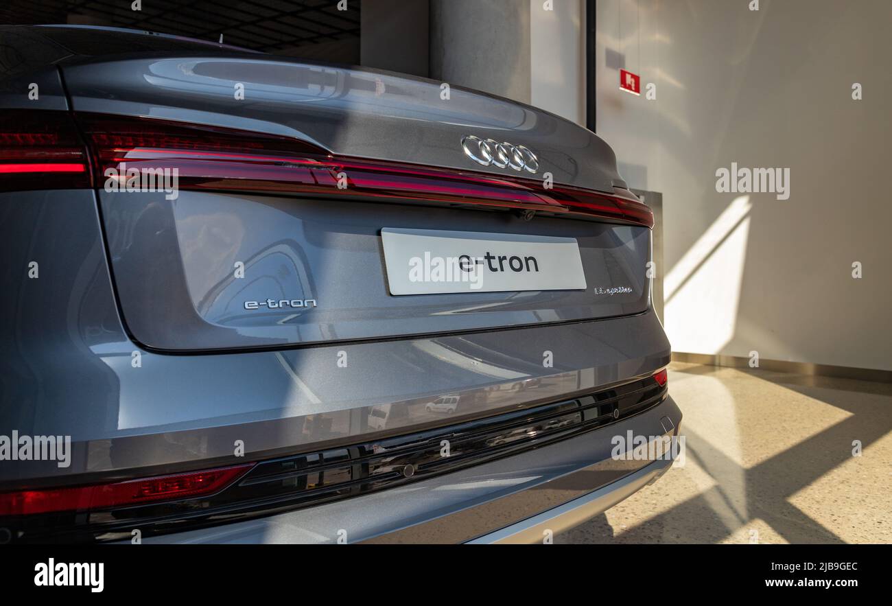 A picture of the back of a silver Audi e-tron 55 quattro. Stock Photo