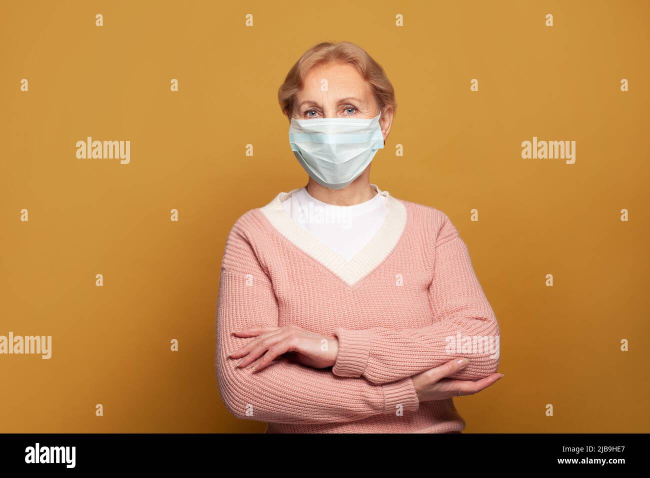 Mature woman wearing facial mask hi-res stock photography and images ...