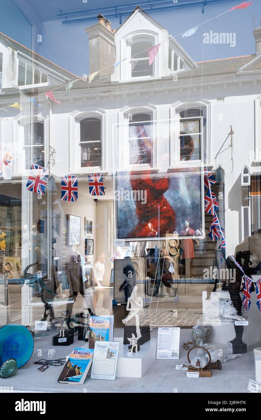 Shop window reflections of the Queen's Platinum Jubilee celebrations