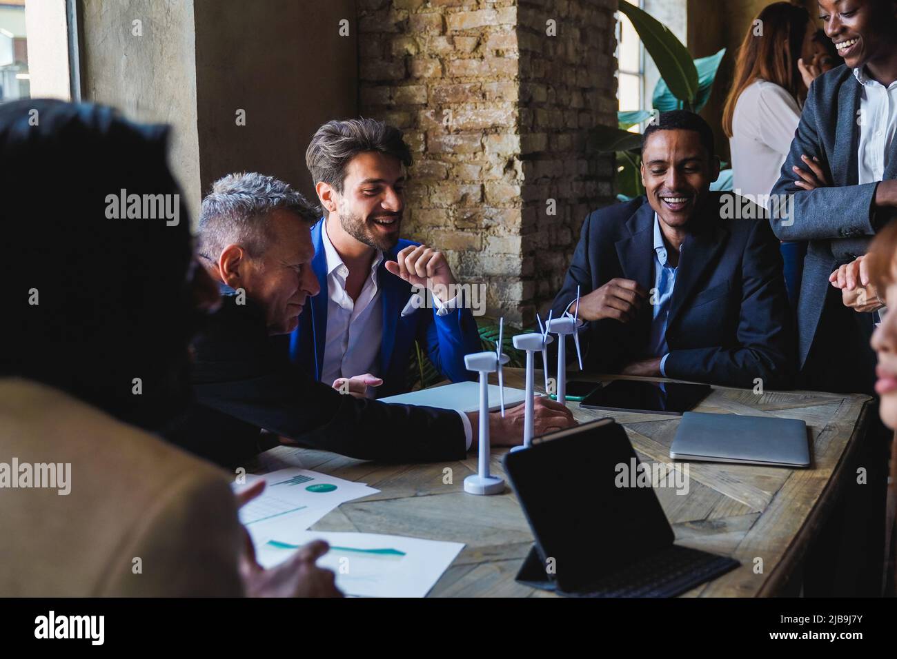 Multiethnic business people working on sustainable renewable energy project inside office - Green alternative electricity concept Stock Photo