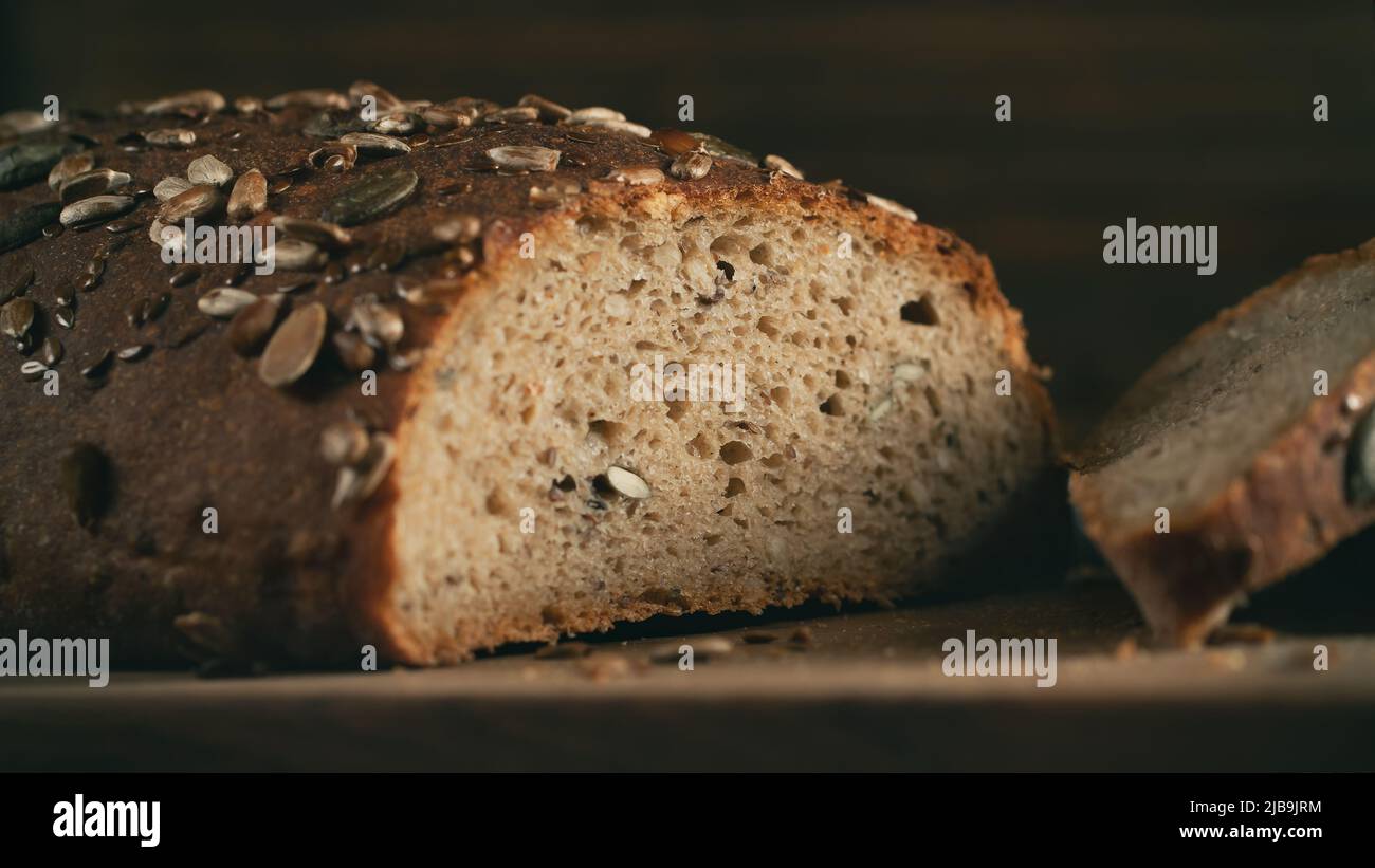 Close-up of homemade whole grain bread crumb with seeds. Selective focus. Stock Photo