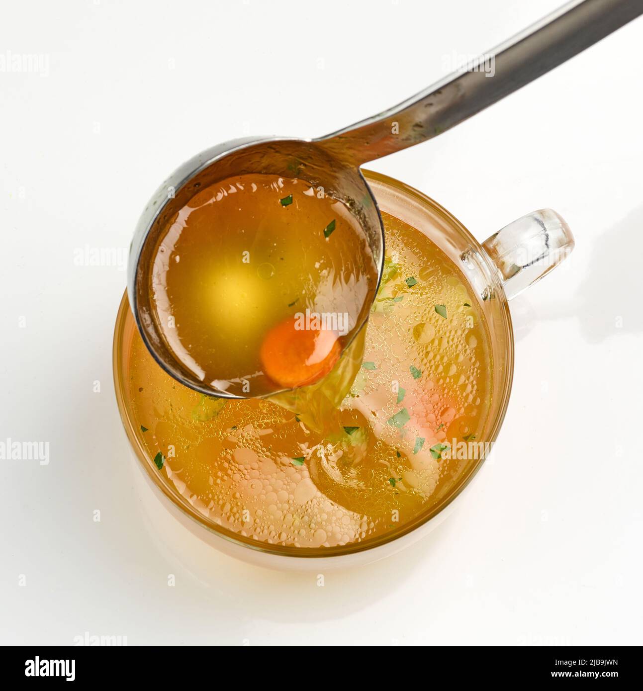cup of fresh chicken bouillon on white background, top view Stock Photo