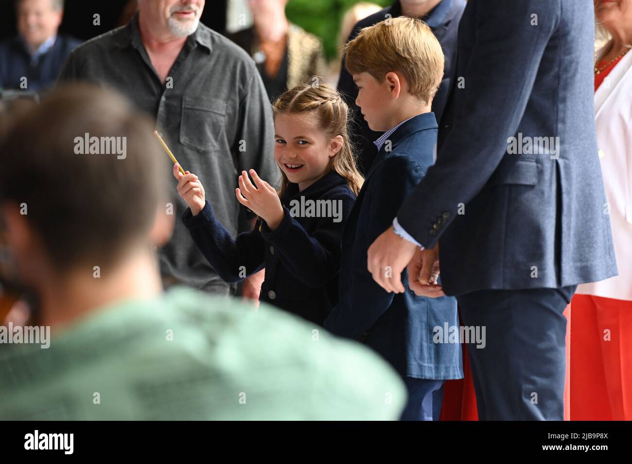 Princess Charlotte laughs as she conducts a band next to her brother(02)