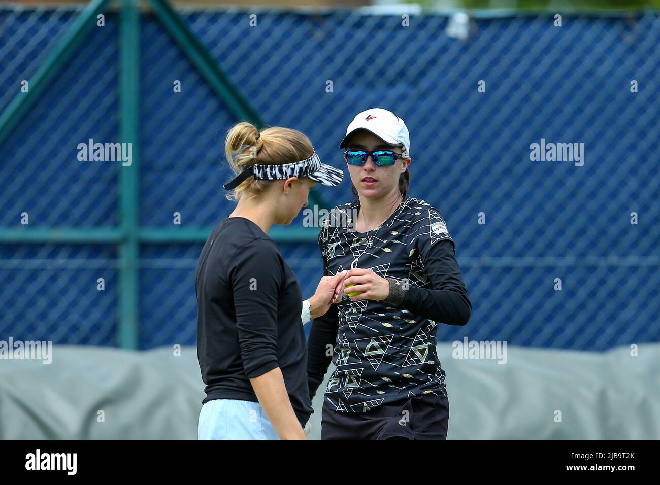 4th June 2022; Surbiton Racket &amp; Fitness Club, Surbiton, London, England: Surbiton Trophy Tennis tournament, womens doubles final; Fernanda Contreras (MEZ) and Catherine Harrison (USA) conferring in their match against Ingrid Neel (USA) and Rosalie Van der Hoek (NED) Stock Photo