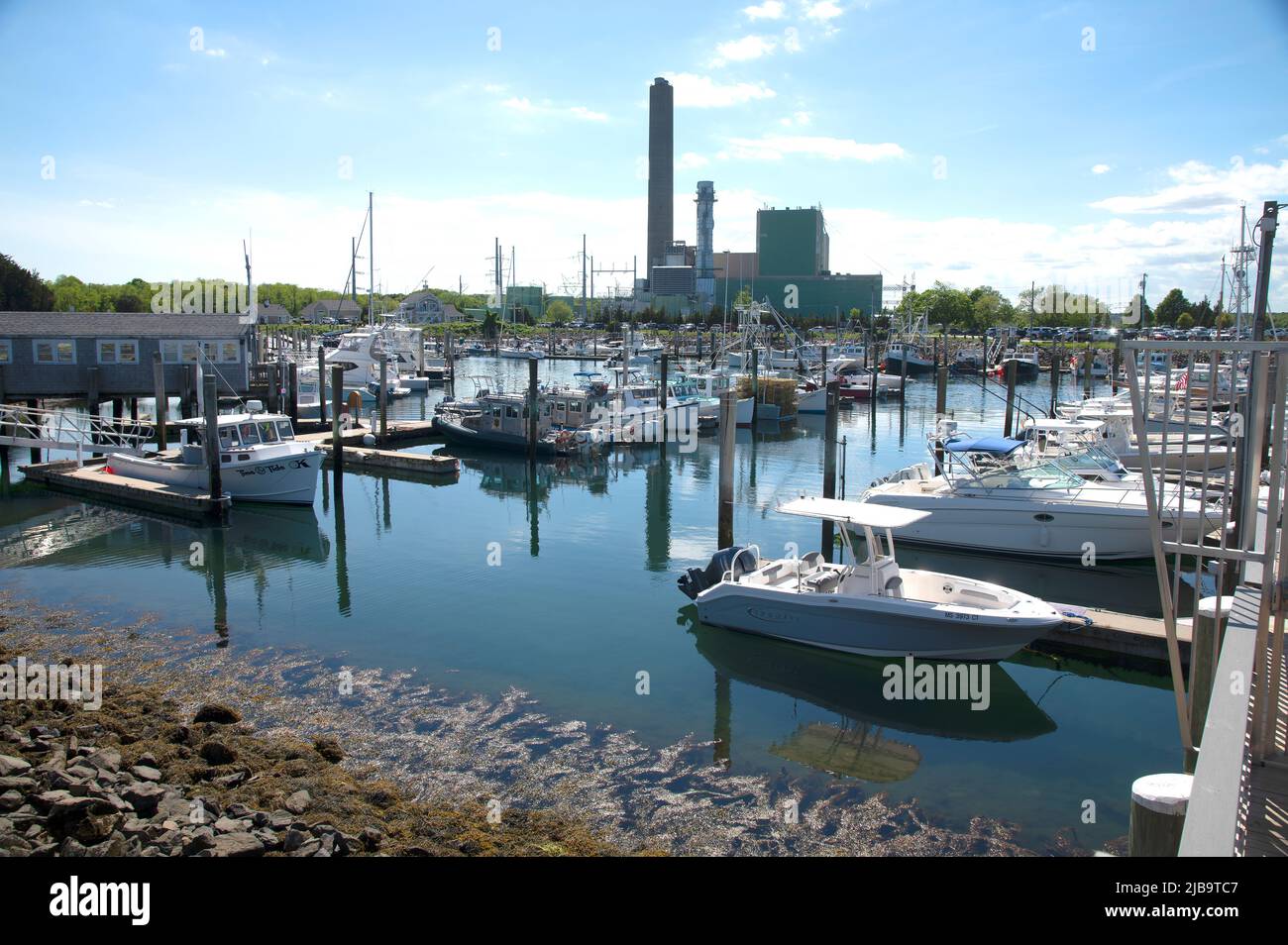 Sandwich Marina - Sandwich, Massachusetts, Cape Cod, USA. Canal power plant in the background Stock Photo