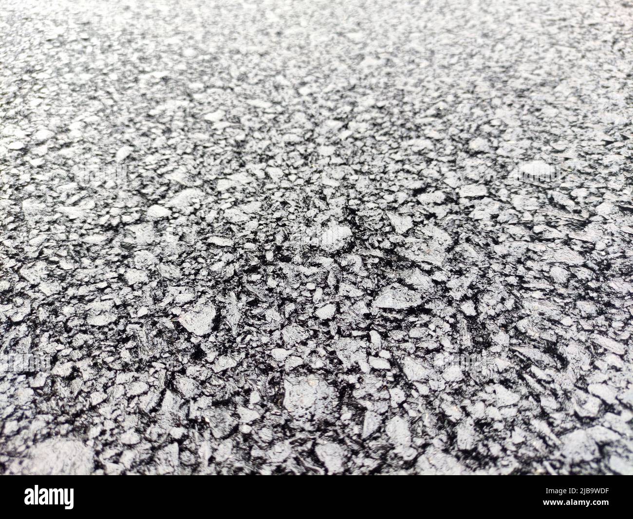 Asphalt road background, close view. Highway pavement texture macro