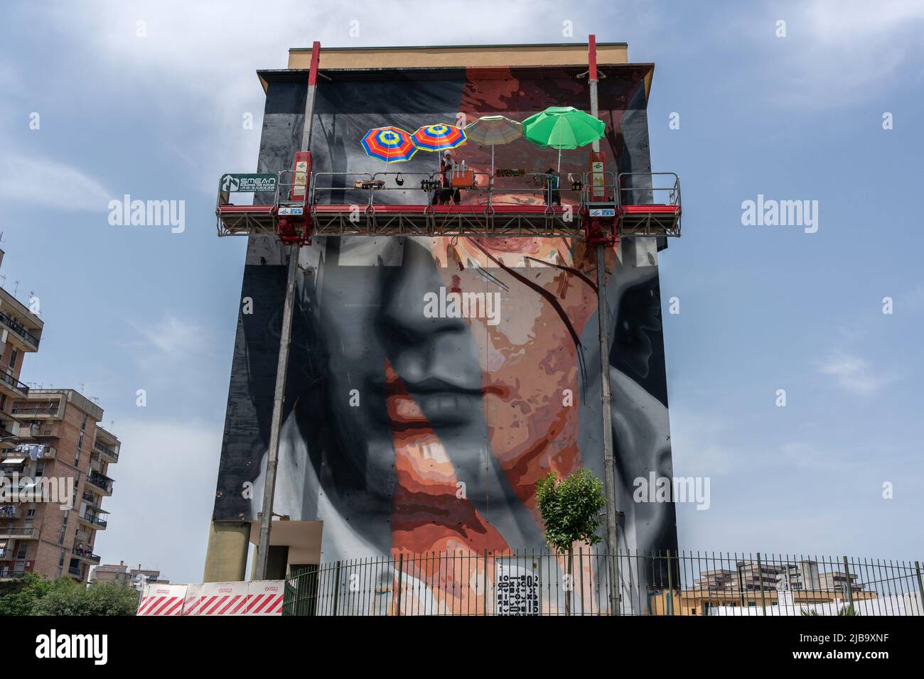 Jorit, a Neapolitan street artist, is in Naples, in the Scampia district, to create a mural with Trisha on the occasion of “Muraria”, a festival promoted by the Municipality of Naples with funding from the Metropolitan City. The work continues from May 28, 2022 to June 4, 2022 and will consist of a work depicting Fabrizio De Andrè. Stock Photo