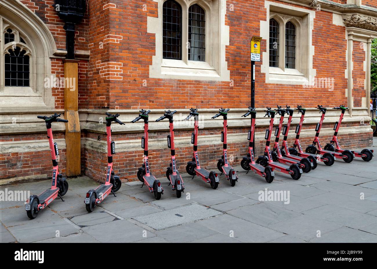 VOI electric scooters for hire in the city center of Cambridge, Cambridgeshire, England, United Kingdom. Stock Photo