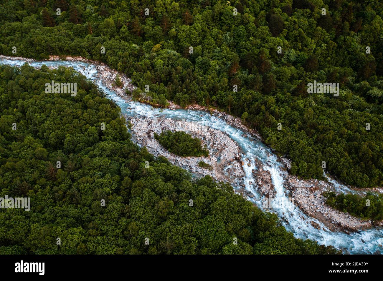 aerial view of a mountain river flowing through the forest Stock Photo ...