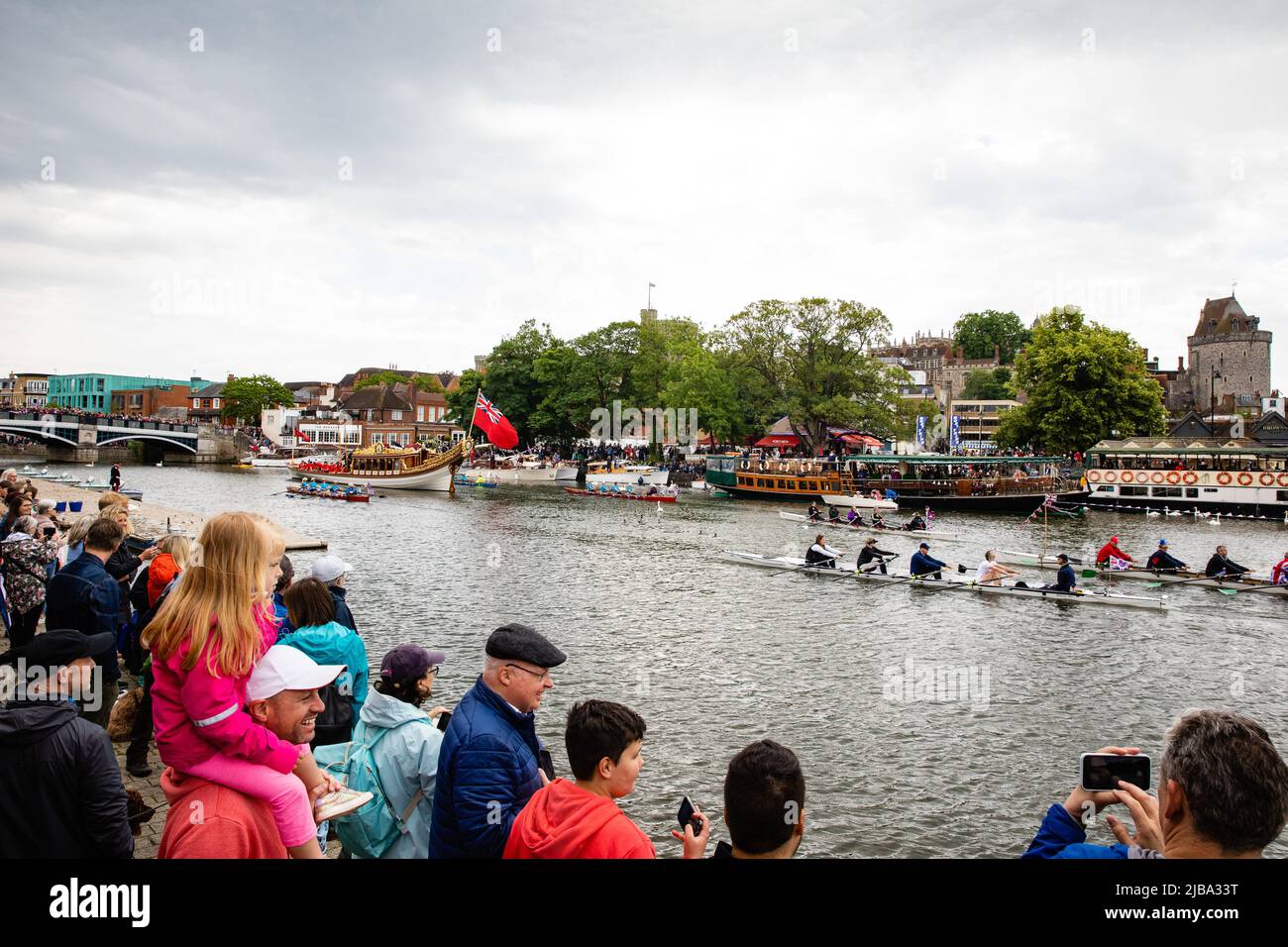 Windsor, UK. 4th June, 2022. Gloriana, the Queen's Row Barge, passes Windsor Castle at the head