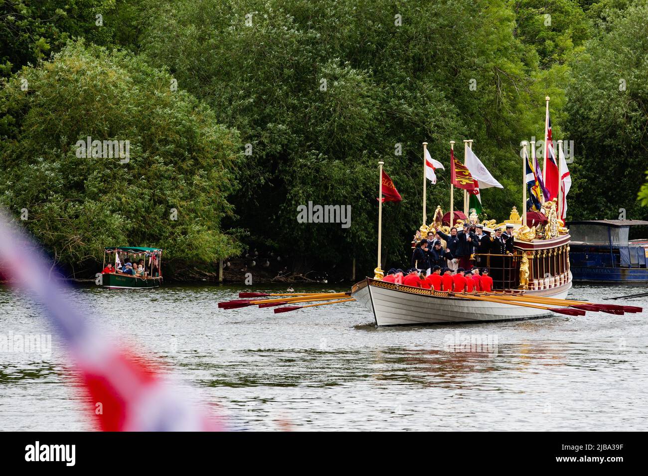 Windsor, UK. 4th June, 2022. Gloriana, the Queen's Row Barge, passes