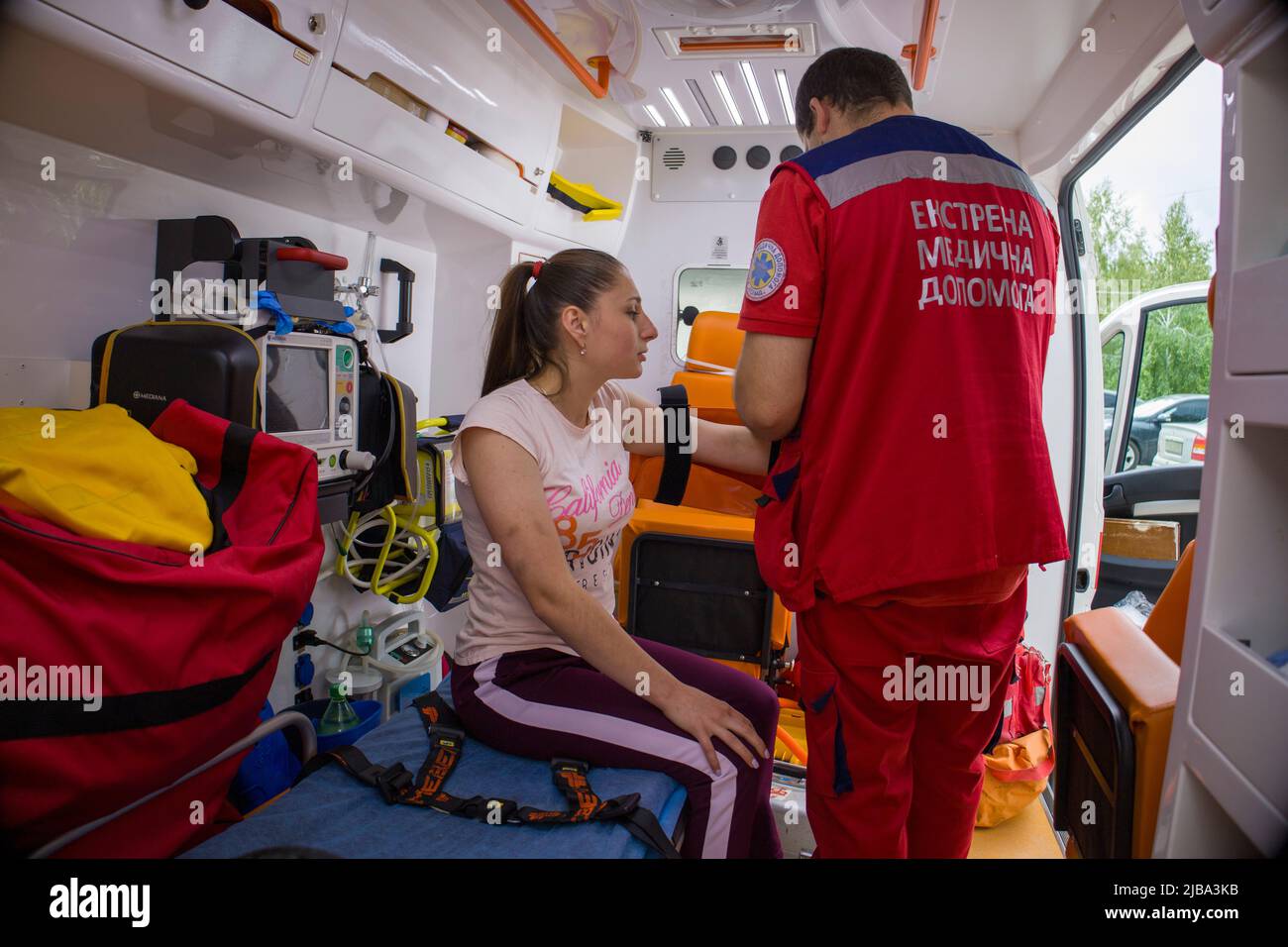 Kyiv. Ukraine. 2.06.2022. An ambulance paramedic treats the girl Stock Photo