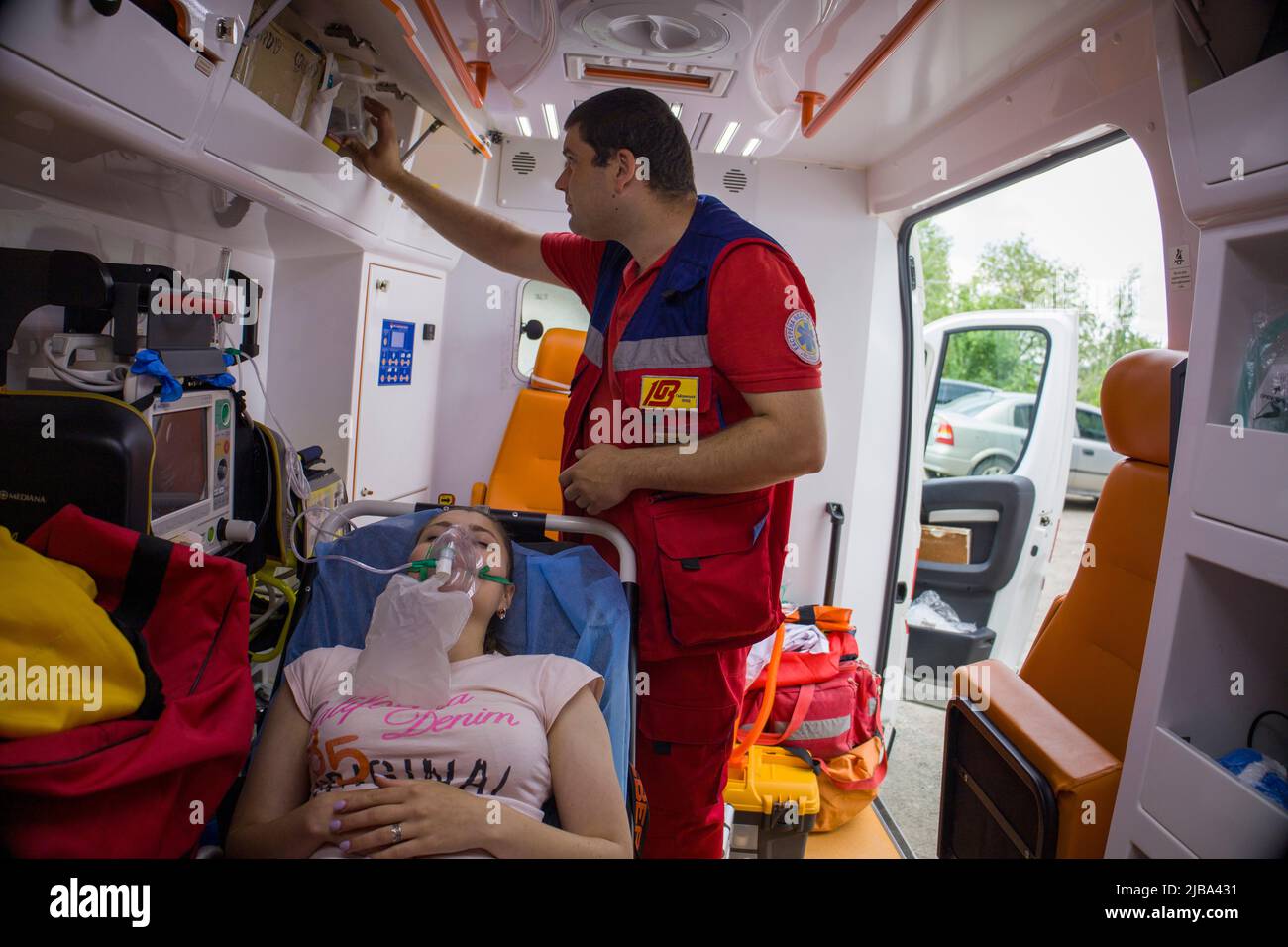 Kyiv. Ukraine. 2.06.2022. An ambulance paramedic treats the girl Stock Photo