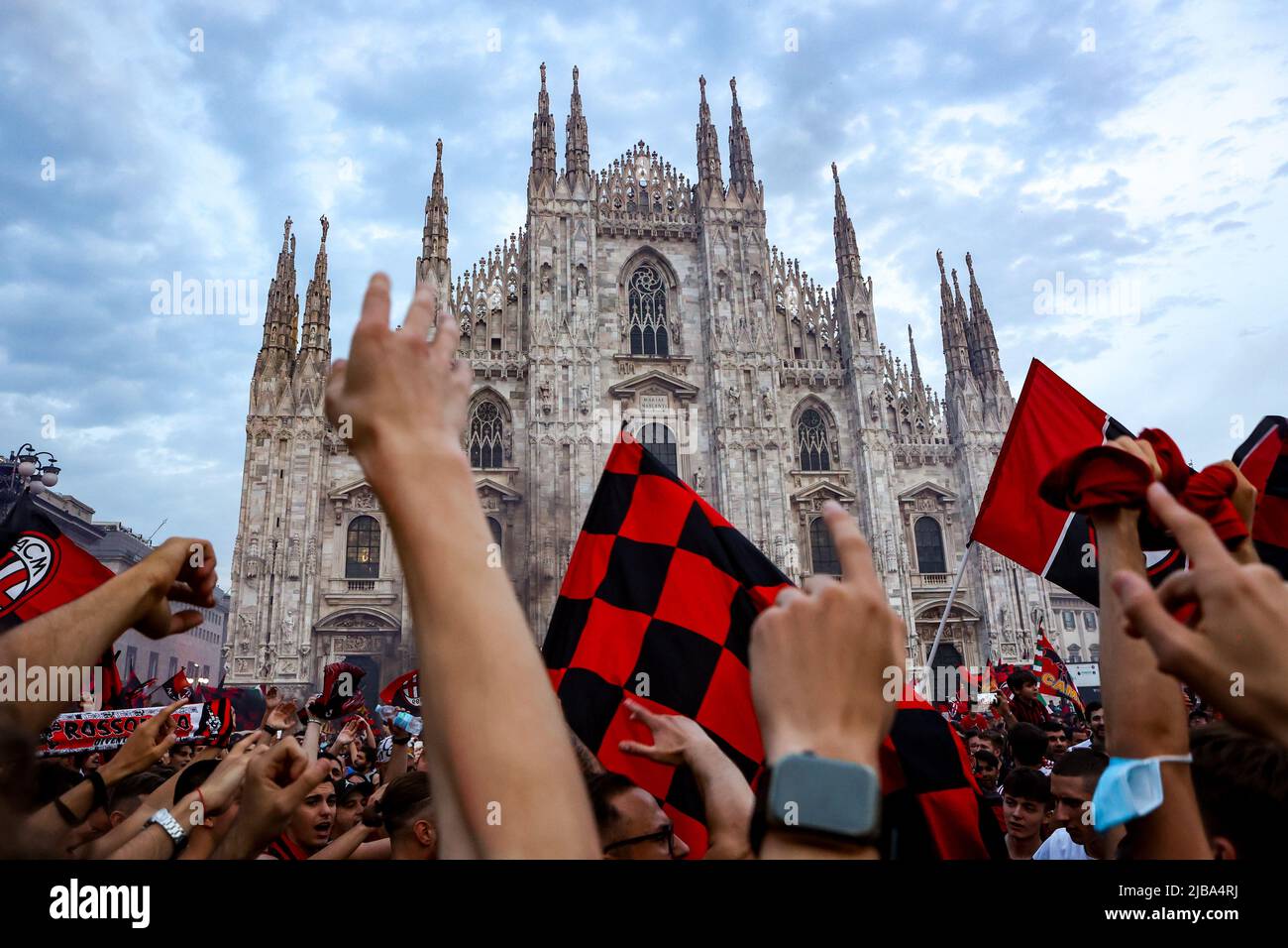 Milan fans celebrate in Piazza Duomo after winning Serie A and the Scudetto in Milano, Italy, on May 22 2022 Stock Photo