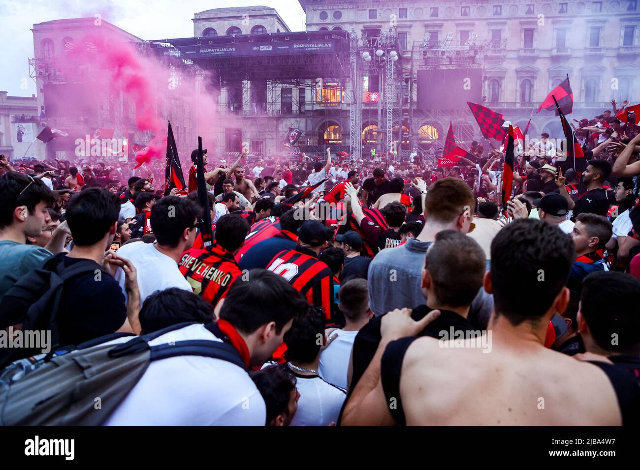 Milan fans celebrate in Piazza Duomo after winning Serie A and the Scudetto in Milano, Italy, on May 22 2022 Stock Photo