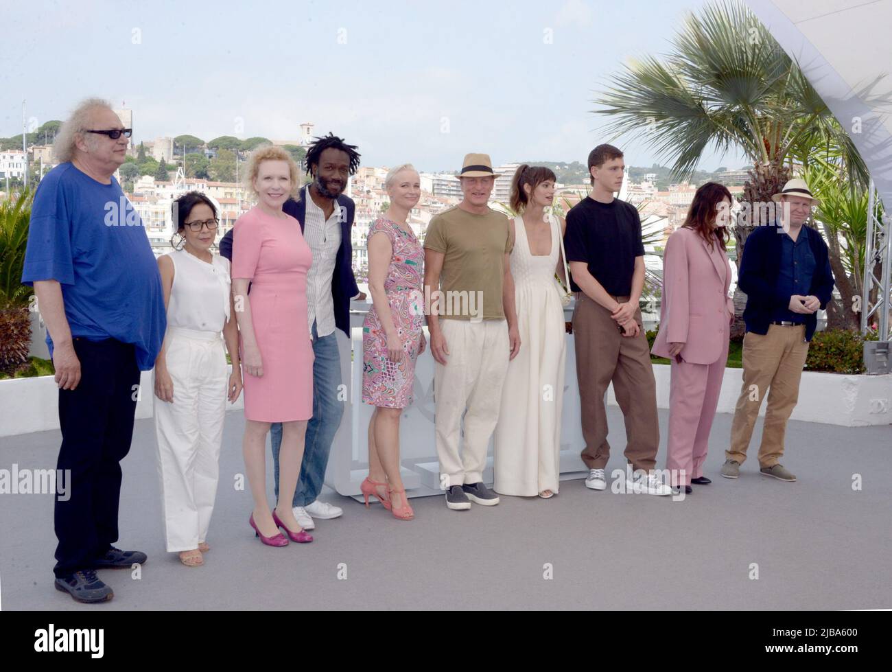 May 22, 2022, CANNES, France: CANNES, FRANCE - MAY 22: (L to R) Producer Erik Hemmendorff, Zlatko Buric, Dolly De Leon, Sunnyi Melles, Jean-Christophe Folly, Vicki Berlin, Woody Harrelson, Director Ruben Ostlund, Charlbi Dean, Harris Dickinson, Iris Berben, Henrik Dorsin an Producer Philippe Bober attend the photocall for ''Triangle Of Sadness'' during the 75th annual Cannes film festival at Palais des Festivals on May 22, 2022 in Cannes, France. (Credit Image: © Frederick Injimbert/ZUMA Press Wire) Stock Photo
