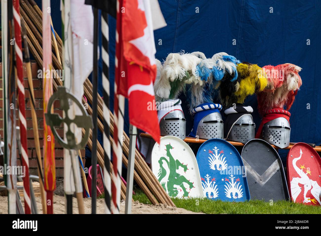 Pfingst-Spektakulum in Muelheim an der Ruhr, Germany. Knights helmets with feathers and shields. Event with a medieval knights tournament with camp and crafts market in Müga-Park near Schloss Broich castle. Stock Photo