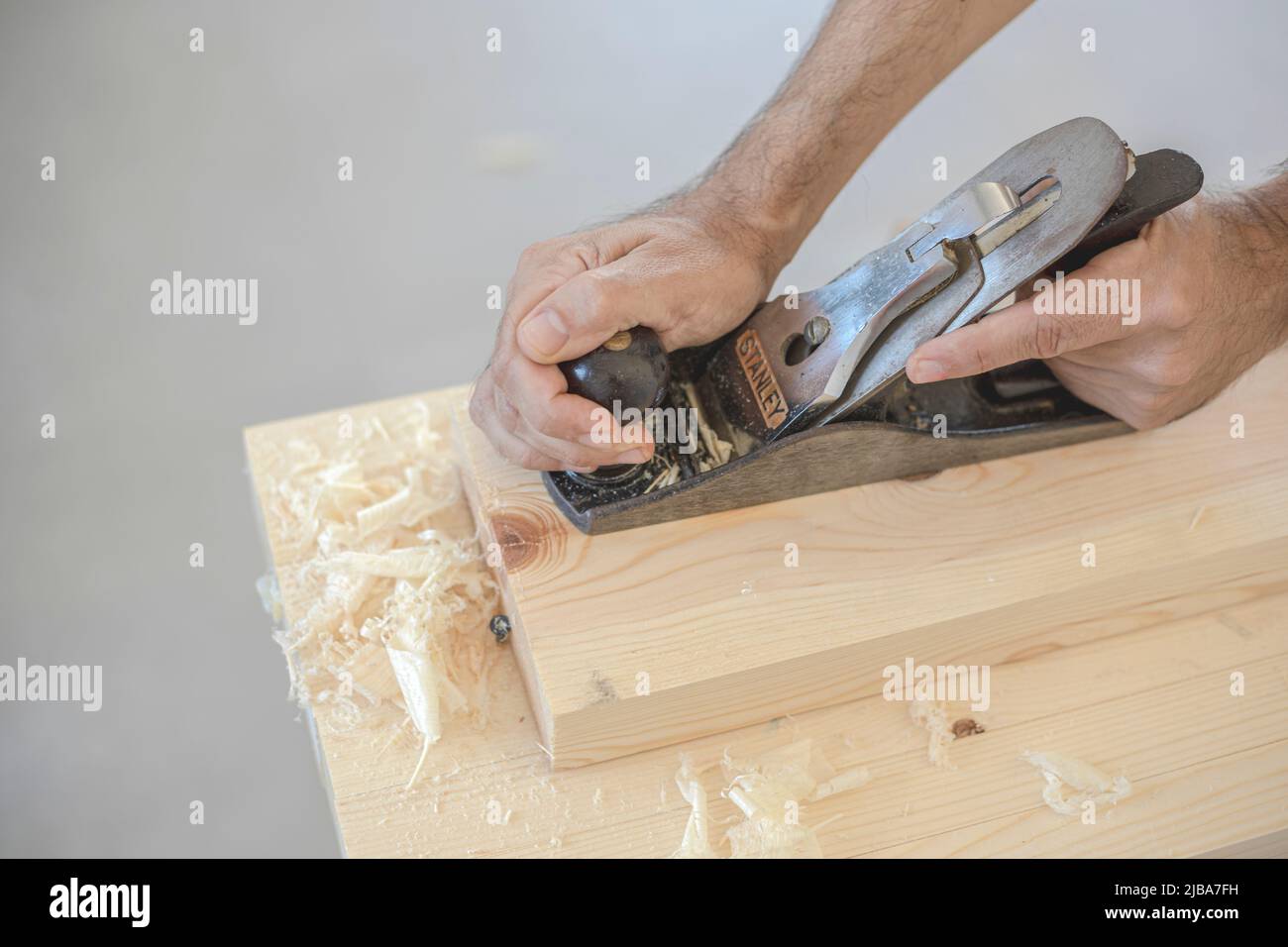 Traditional, manual planer for hand planing raw wood used by a