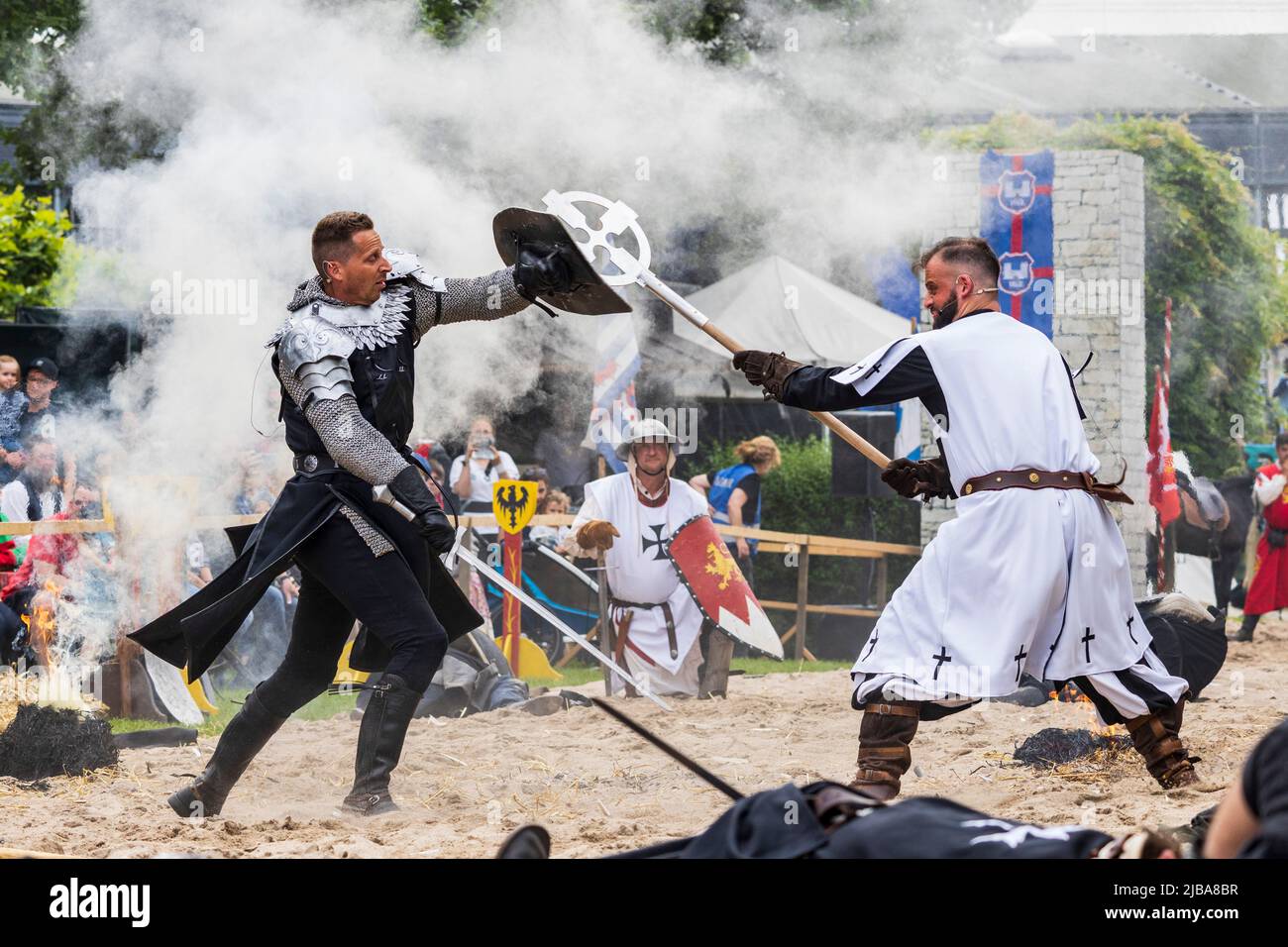 Pfingst-Spektakulum in Muelheim an der Ruhr, Germany. Knights fighting. Event with a medieval knights tournament with camp and crafts market in Müga-Park near Schloss Broich castle. Stock Photo