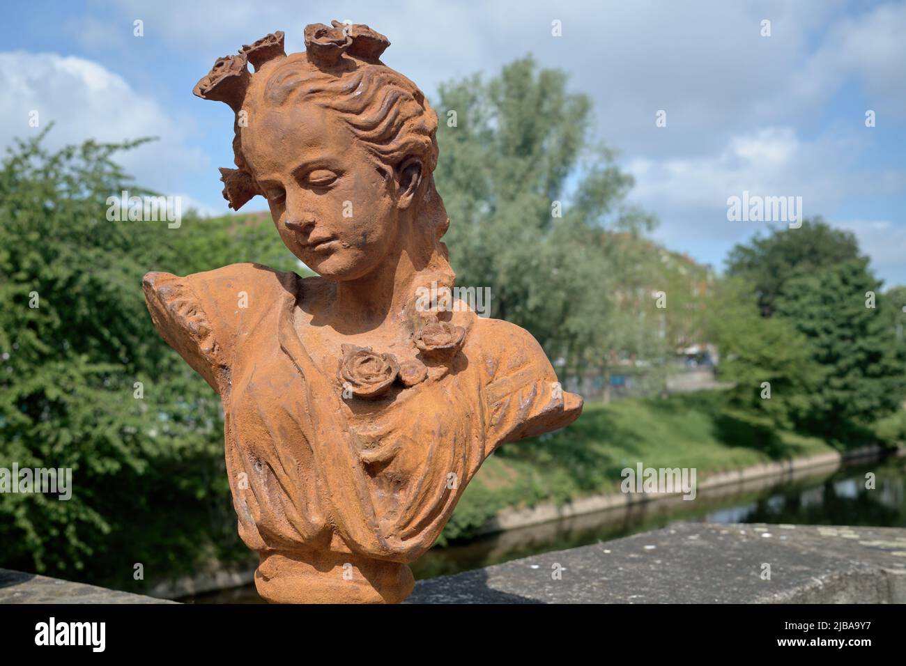 Bust of woman with the view of the banks of the Leine River in the background (No. 2) Stock Photo