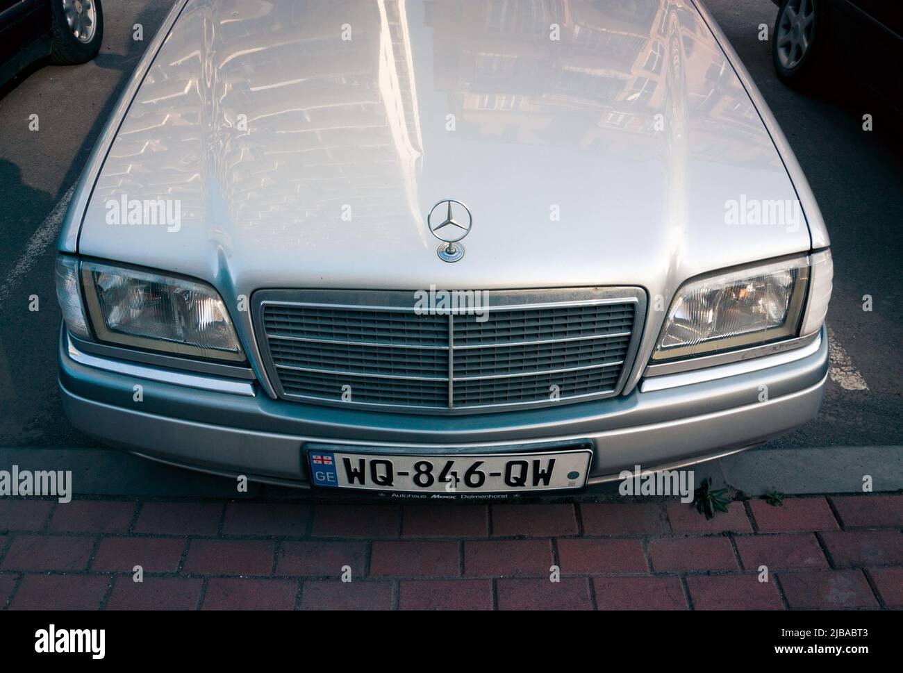 STRASBOURG, FRANCE - SEP 21, 2014: White Mercedes-Benz E Class taxi parked  on a rainy day in center of Strasbourg, place Kleber next to cafe Stock  Photo - Alamy