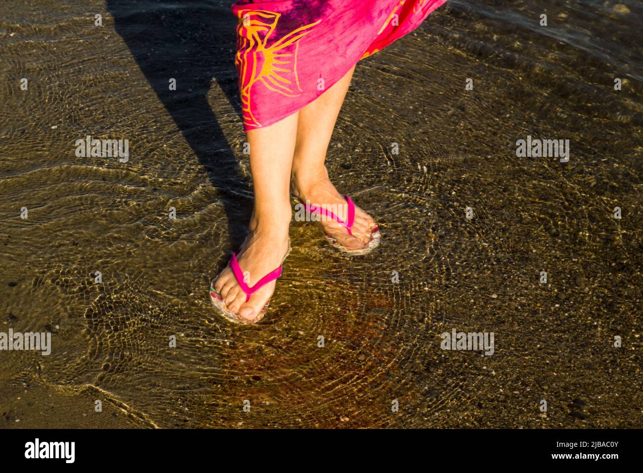Woman wearing flip flops hi-res stock photography and images - Alamy