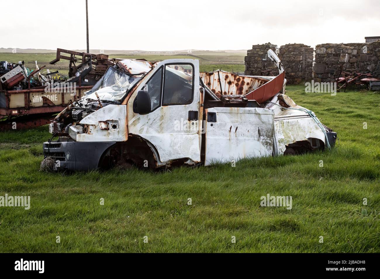 Wreck of a white abandoned van on North Uist, Outer Hebrides, Scotland Stock Photo
