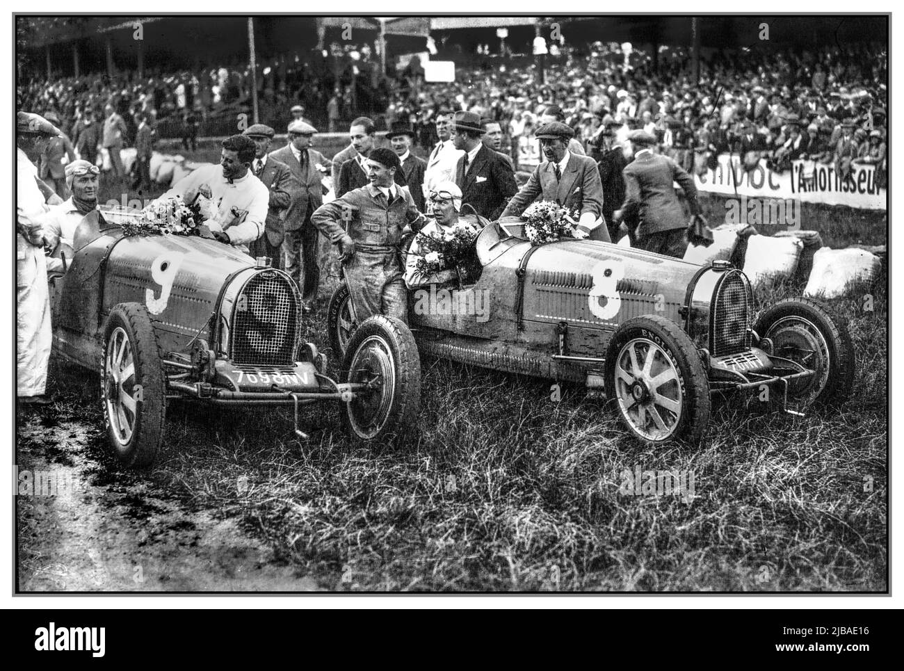 Vintage 1930 Belgian Grand Prix winners (left) Louis Chiron First in number 9 Bugatti and Guy Bouriat Second in car number 8., Race also known as the VII Grand Prix d'Europe was a Grand Prix motor race held at Spa-Francorchamps on 20 July 1930. The race was held over 40 laps of a 14.914 km circuit for a total race distance of 596.560 km and was won by Louis Chiron driving a Bugatti. Stock Photo
