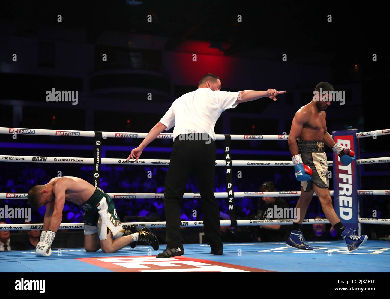 Gamal Yafai (right) knocks down Sean Cairns (left) in the super light weight bout at the Motorpoint Arena Cardiff. Picture date: Saturday June 4, 2022. Stock Photo