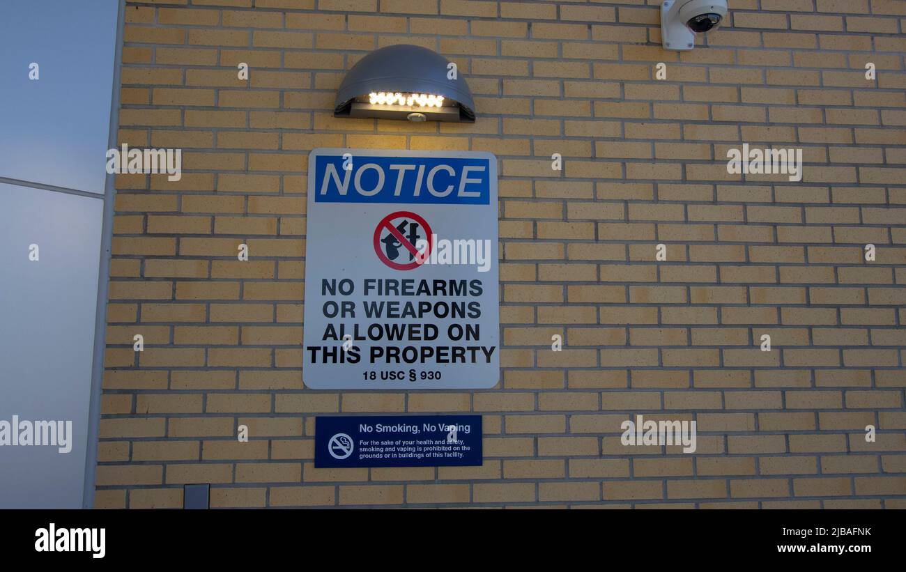 No Firearms warning sign on a VA Clinic entrance Stock Photo