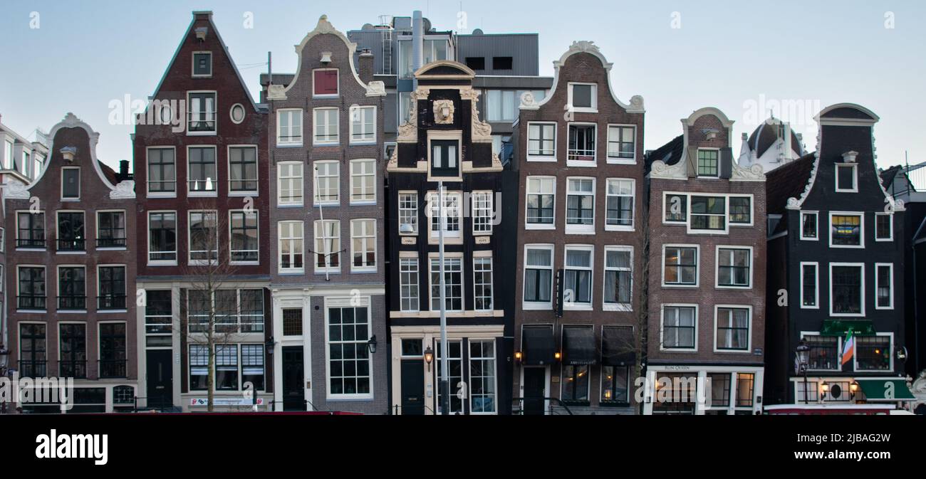 Iconic Dancing Houses In Amsterdam Netherlands Seen From Across Amstel River Stock Photo Alamy