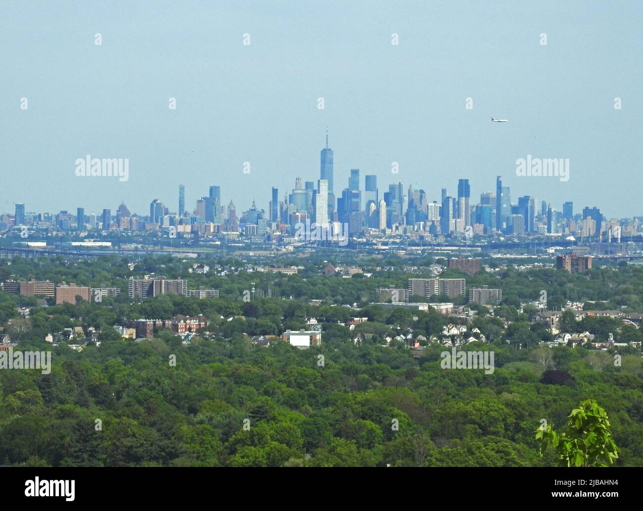 View of New York City's Manhattan skyline from Eagle Rock Reservation in Montclair, NJ, with some atmospheric distortion caused by the distance -01 Stock Photo